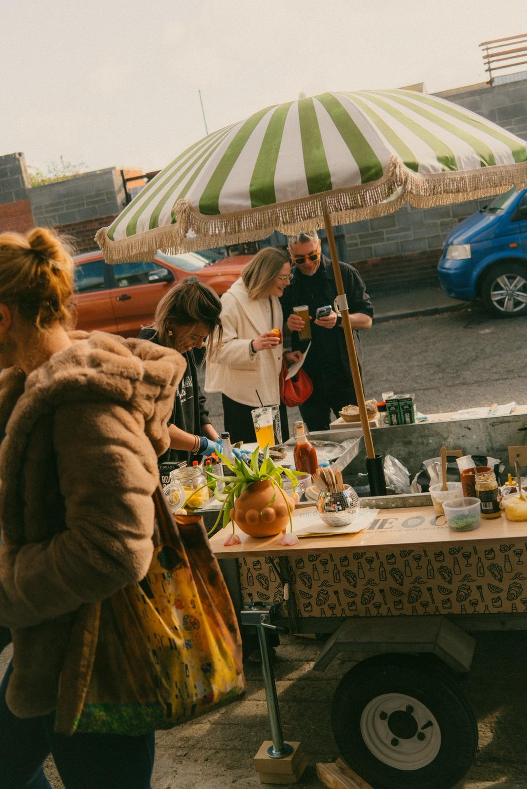 Customers gathered at the oyster trailer at a public event